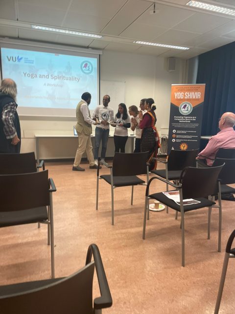 Contributors sharing a moment at the close of a session